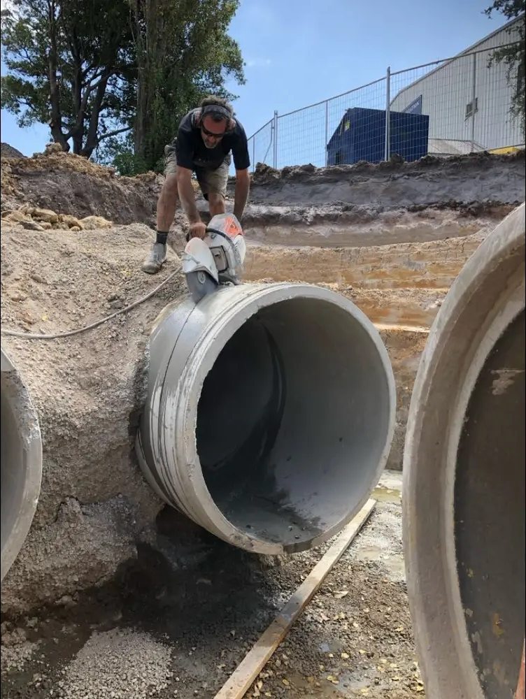 Concrete pipe cutting on a work site
